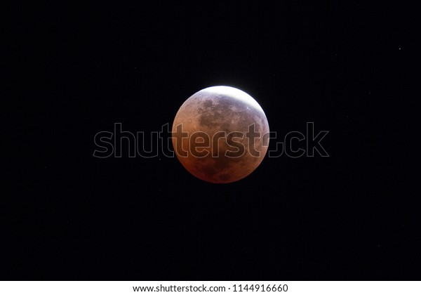 Total Lunar Eclipse of\
July 2018. The earth\'s penumbra leaving the lunar surface at\
05:24hrs visible during the longest full eclipse of this century. \
Imaged from Papar, MY