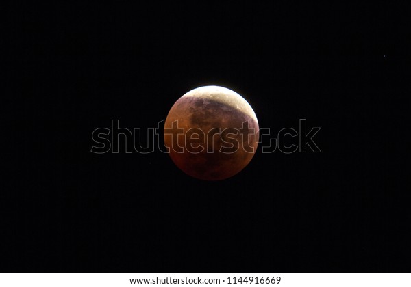 Total Lunar Eclipse of\
July 2018. The earth\'s penumbra leaving the lunar surface at\
05:28hrs visible during the longest full eclipse of this century. \
Imaged from Papar, MY