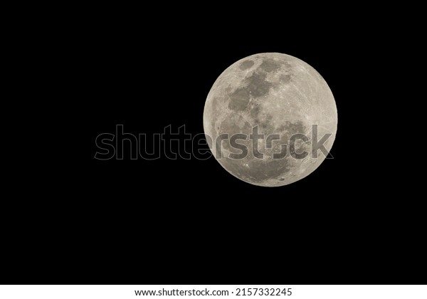 Total lunar eclipse. The moon in the penumbra\
phase of the eclipse.\
Astronomy.