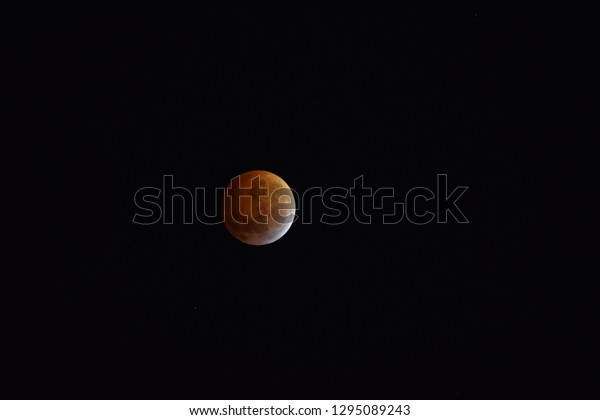 total lunar eclipse. The\
Moon\'s surface is starting to leave the Earth\'s umbra. Buenos\
Aires, Argentina.