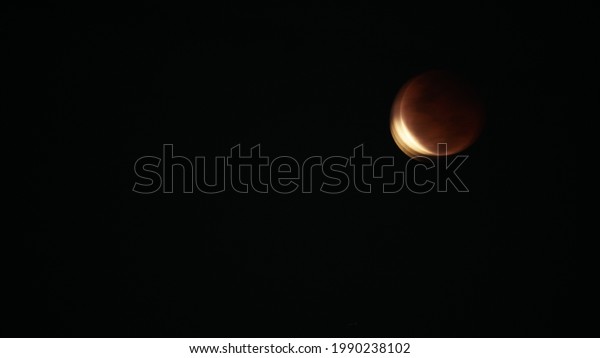 The total lunar eclipse\
is observed to start partially closing before the total lunar\
eclipse occurs.