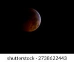 A total lunar eclipse is seen as the full moon is shadowed by the Earth on the arrival of the winter solstice, December 21, 2010 in Arlington, VA. Photo from outer space.