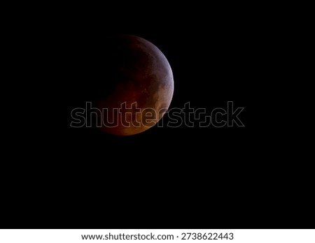 A total lunar eclipse is seen as the full moon is shadowed by the Earth on the arrival of the winter solstice, December 21, 2010 in Arlington, VA. Photo from outer space.