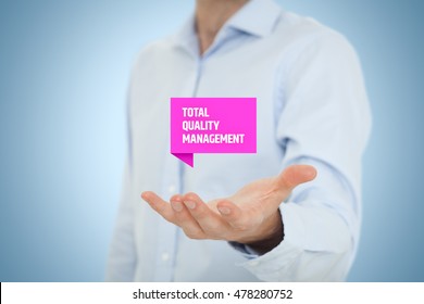 Total quality management concept. TQ manager hold virtual label with text TQM. - Shutterstock ID 478280752
