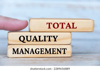 Total quality management text on wooden blocks. Business culture and Operational excellence concept. - Shutterstock ID 2289656889