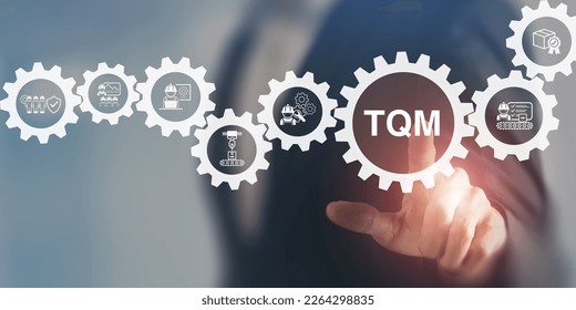 Total quality management (TQM) concept. Touching on smart screen with TQM text on smart background. Management approach to long-term success through customer satisfaction and sustainability. - Shutterstock ID 2264298835