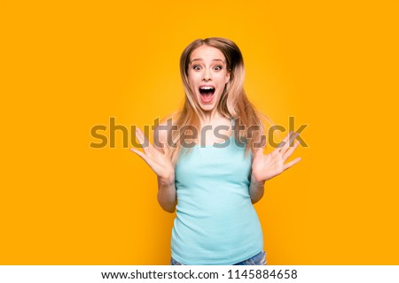 TOTAL SALE! FInally, good news! Portrait of young blonde woman excited about discount isolated on bright yellow background with copy space for text