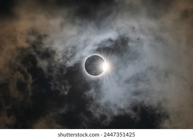 Total Solar Eclipse of 2024 over Wylie, Texas with clouds and diamond ring effect - Powered by Shutterstock