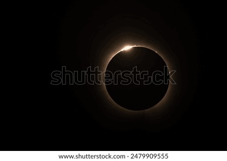 A total solar eclipse in the sky with full coverage of the sun