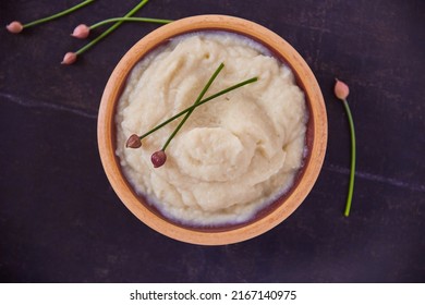 I Totally Regret Eating Healthy Today, Said No One Ever. Overhead Shot Of Cauliflower Mash Puree In A Wooden Bowl On A Black Table.