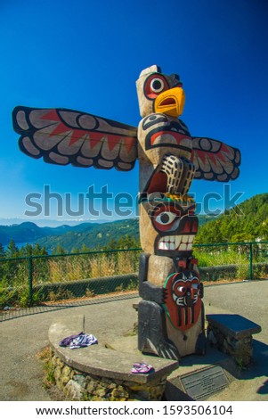 Totem Pole Colorful Against Blue Sky