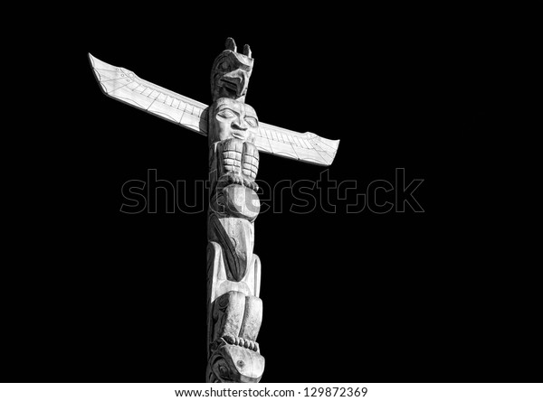 Totem Pole On Black Background Stock Photo (Edit Now) 129872369