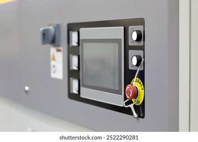 Touch screen control panel of automated industrial equipment close up. Selective focus.