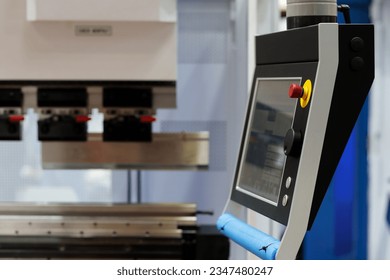 Touch screen control panel of CNC hydraulic press brake bending machine. Selective focus.