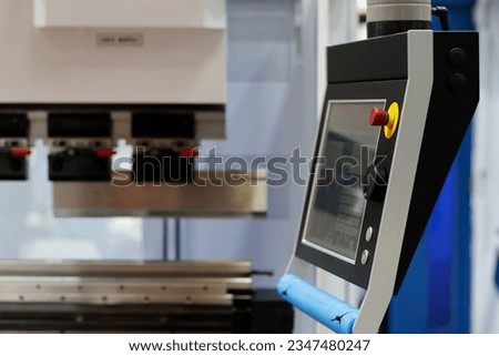 Touch screen control panel of CNC hydraulic press brake bending machine. Selective focus.