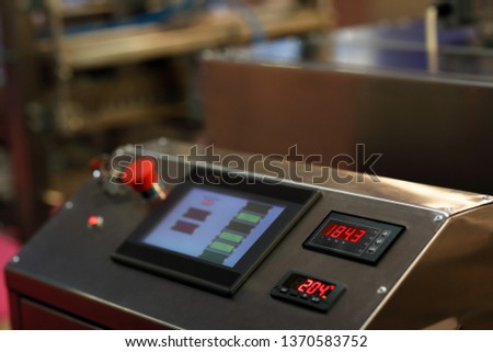 Touch screen control panel of modern industrial equipment. Selective focus.