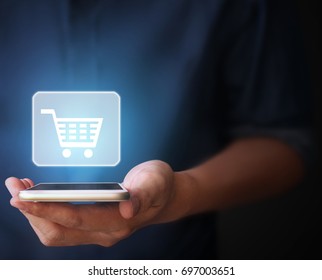 Touch screen smartphone in hand - Shutterstock ID 697003651