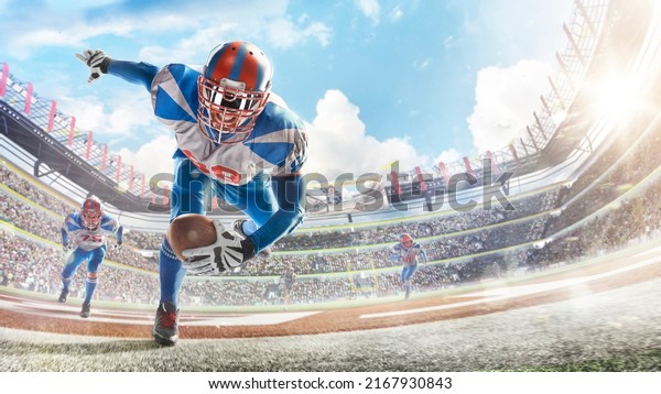 Touchdown in football. Young agile american football\
player running fast towards goal line. Sportsman in action. Sports\
emotions. Fans