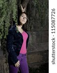 Touching on a pine tree, a young countryside girl is looking up and thinking/Looking Up