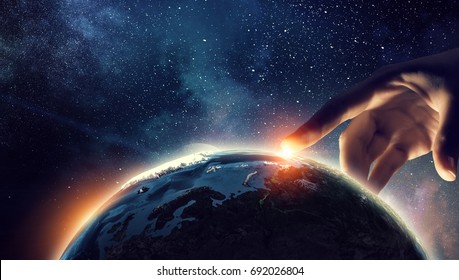 Touching planet with finger