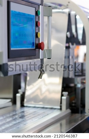 Touchscreen control panel of tablet blister packing machine. Selective focus.