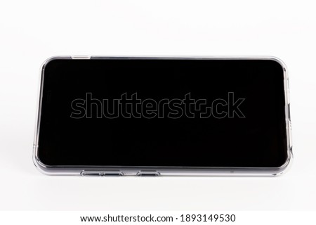 Touchscreen smartphone in silicone cover in white background. 