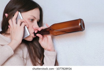 Tough Conversation To Women On The Phone. Young Beautiful Woman Drinks Beer.