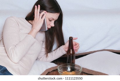 Tough Conversation To Women On The Phone. Young Beautiful Woman Drinks Beer.