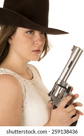 Tough Cowgirl Holding Pistol Looking Far Away