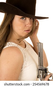 Tough Cowgirl Holding Pistol Staring Down Expression