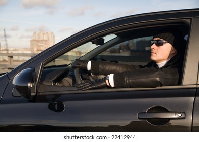 Tough Guy In Leather Jacket In His Car At Sunny Day