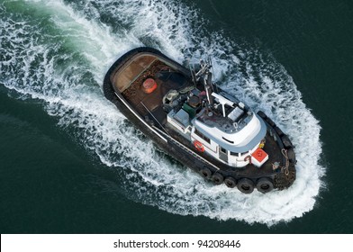 A tough little tugboat seen from above.