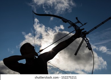 Tough Man With Bow And Arrows, Close Up With Cloudy Sky At Background