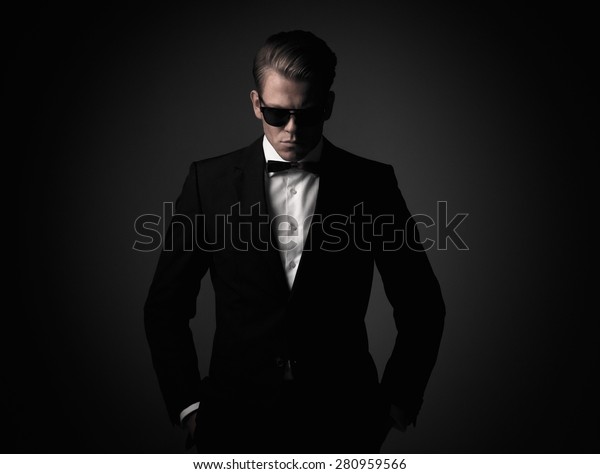 Tough sharp dressed man\
in black suit 
