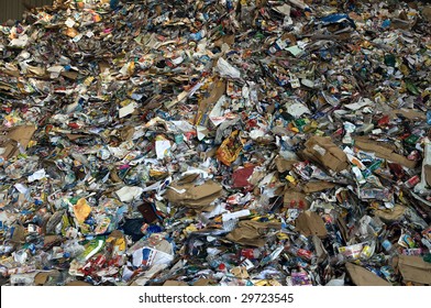 TOULOUSE, FRANCE - CIRCA 2008: Newspapers and plastic bottles lie in a heap at an undisclosed recycling facility circa 2008 in Toulouse. The paper and plastic will be sorted and baled.