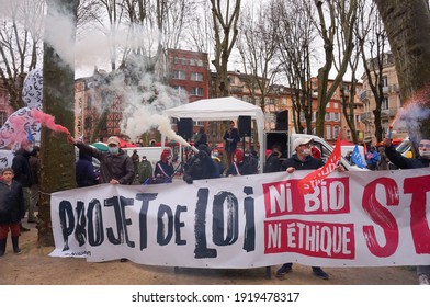 Toulouse, France - Jan. 30, 2021 - Young pro-family activists holding a banner against the Government's Bioethics bill at Marchons Enfants demonstration, on Place du Salin, among other protesters