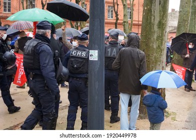 Toulouse, France - Jan. 30, 2021 - Intervention of CRS (crowd control) police officers at a pro family Marchons Enfants demonstration on Place du Salin, on the move to chase away Antifa disrupters