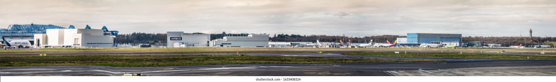 Toulouse, France - Januar 2020 Panoramic View Of  Airbus Plant, Toulouse Blagnac Airport (TLS, LFBO), With A Lot Of New Build Airplanes Parked Around The Hangers