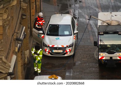 Toulouse, France - June 2021 - Agents Of The Urban Community Of Toulouse Métropole At Work Early In The Morning, With A Peugeot 308 Service Vehicle And A Street Sweeper Of The Urban Cleanliness