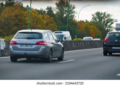 Toulouse, France - June 2021 - Rear of a light grey Peugeot 308 SW, the station wagon version of the 308, a compact family car produced by the French auto manufacturer PSA, driving on the motorway