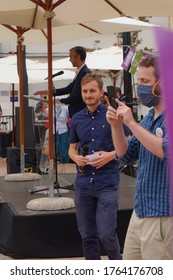 Toulouse, France - June 25, 2020 - Young Members Of The Campaign Staff Take Photos While Antoine Maurice, Archipel Citoyen's Left-wing Candidate, Delivers A Speech At An Outdoor Election Meeting