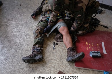 TOULOUSE, FRANCE - NOVEMBER 30: soldiers caring for the fake injury of a soldier during a mission in a training building for the sentinelle operation, Occitanie, Toulouse, France on november 30, 2017 