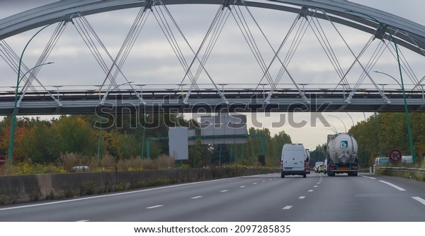 Toulouse, France - Oct. 2021 - The cable-stayed\
Viaduct of the Hers, a railway bridge that supports the Line A of\
Tisséo metro, ahead of Balma-Gramont Terminal Station, overhanging\
the ring road A61