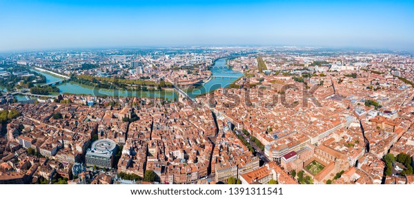 Toulouse and Garonne river aerial panoramic view.\
Toulouse is the capital of Haute Garonne department and Occitanie\
region in France.