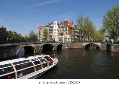 Tour Boat In An Amsterdam Canal