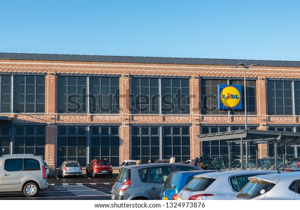 Tourcoing,FRANCE-February27,2019:Building and\
logo of the newly opened supermarket Lidl.Lidl is a German global\
discount supermarket chain,operating in 26 European countries and\
the United\
States.