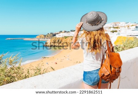 Tourism in beautiful Algarve beach- Woman travel in Portugal- beach albufeira