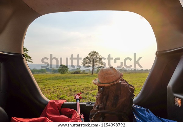 A tourism concept\
picture of travller properties in car while they are travel on\
their summer vacation. 