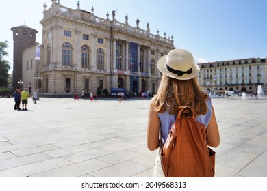 Tourism in Europe. Back view of young female backpacker visiting Turin, Italy.