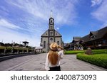 Tourism in Gramado, Brazil. Young tourist woman visiting Gramado town on Christmas time, Rio Grande do Sul, Southern Brazil.